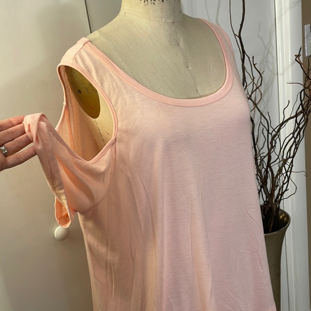 Kori pink short sleeve blouse with cold shoulder sleeve and ruffle hem